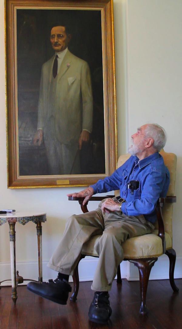 Artist Marshall Bouldin III admiring his Grandfather in the first commissioned portrait the painter ever painted.