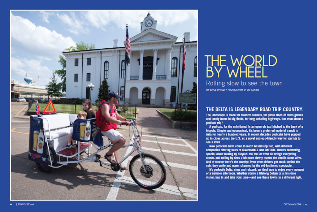 Family rides a pedal cab in front of courthouse.