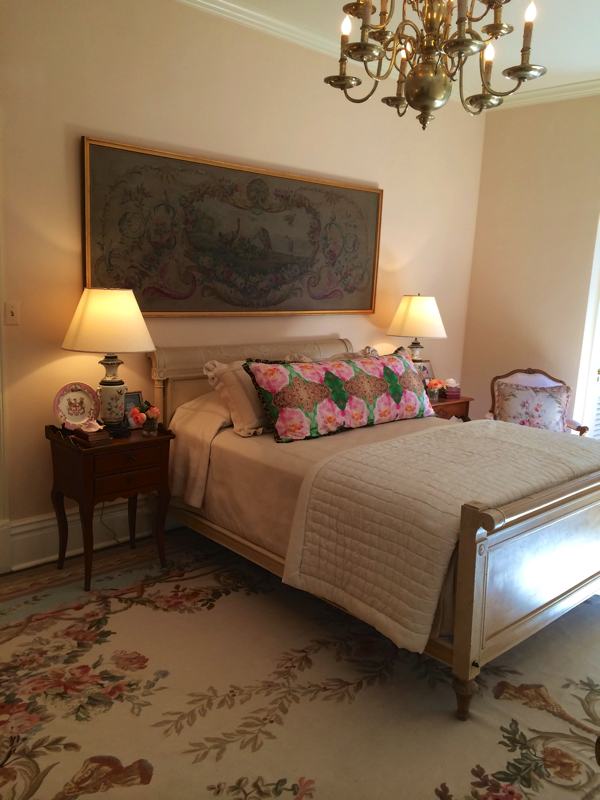 A bedroom with premium antiques in Mary Helen McCoy's home gallery. Kim Duease fabric on pillow.