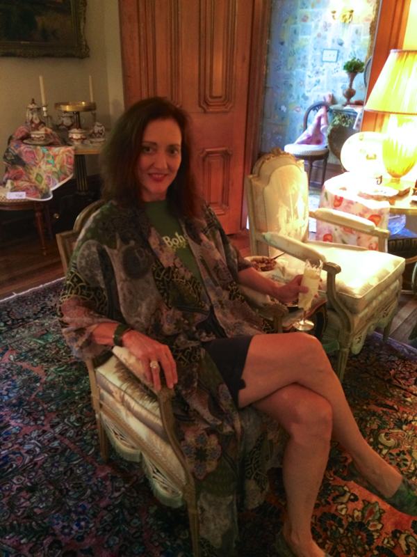 Magical Madge sitting in one of two Louis XVI period chairs attributed to chair maker Sené.