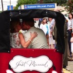 Newlyweds in a horse-drawn carriage, just married.