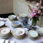 Table setting with floral centerpiece and plates.