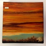 Abstract painting of a sunset with trees.