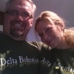 Couple wearing matching "Delta Bohemian" shirts.