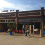 Brick building with "Biscuit Row" sign.