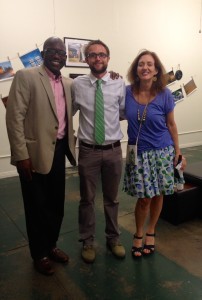 Three people smiling for a group photo.