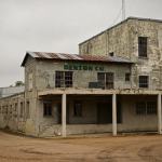 Old Denton Co. building with water tower.