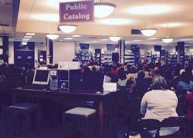 People in a library looking at computers.