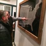 Man pointing at a map of the US.