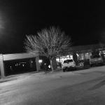 Black and white photo of a restaurant at night.