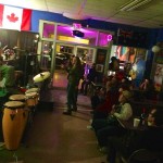 Live band playing in a crowded bar.