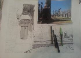 Pencil drawing of columns with pens nearby.