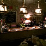 Rustic shop interior with antique lamps and candles.