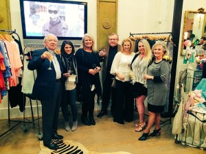 Group of people at a clothing store.