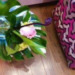 Pink rose and greenery on a table