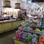 Rustic store interior with jars of colorful candies.