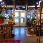 A rustic shop interior with a man in a vest.