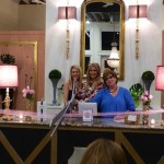 Four women celebrate a store opening.