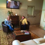 Two women relaxing in a living room.