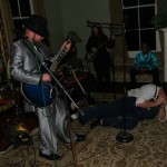 A band playing in a living room.