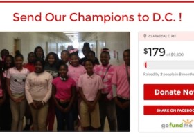 Group of kids in pink shirts fundraising.