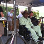 A group of men playing music outdoors.