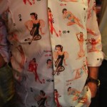 Man wearing a shirt with pinup girls on it.