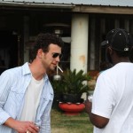 Two men, one with sunglasses, the other in a white shirt.