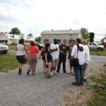 Group of people standing outside a building.