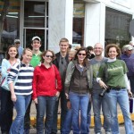 Group of people smiling and posing for a photo.