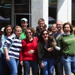 Group of friends smiling for a photo.