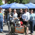 Group of people gathered near a food truck.