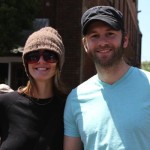 Two people, a woman in a beanie and a man in a blue shirt.