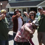 Five people pointing at the camera, smiling.