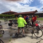 Group of people riding recumbent bikes.