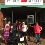 Group of people at a farmer's market.