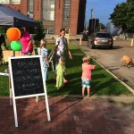 Kids area with chalkboard sign and dog.