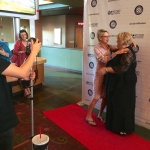 Three women pose at Oxford Film Festival.