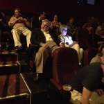 People seated in a movie theater.