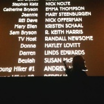 Movie credits with a person pointing.