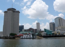 New Orleans skyline with a riverboat.