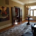 Interior with ornate rug and antique furniture.