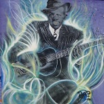 Graffiti mural of a man playing guitar.