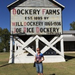 Dockery Farms sign with a woman standing in front.