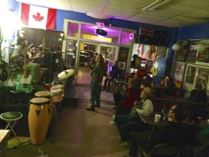 Live music performance with drums and audience.