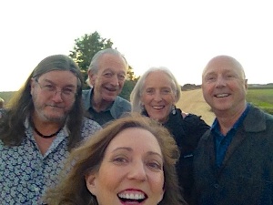 Group portrait of five smiling friends.