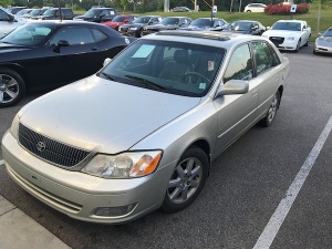 Silver Toyota Avalon parked in a lot.