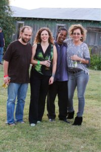 Four friends standing in front of a building.