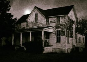 A weathered farmhouse under a full moon.