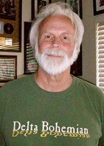 Bill Bowker wearing a Delta Bohemian First Edition green t-shirt